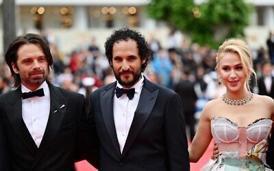 (From L) Romanian-US actor Sebastian Stan, Iranian director Ali Abbasi and Bulgarian actress Maria Bakalova arrive for the screening of the film 'The Apprentice' at the 77th edition of the Cannes Film Festival in Cannes, southern France, on May 20, 2024. (CHRISTOPHE SIMON / AFP)