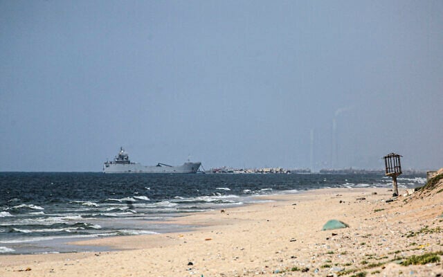 A ship transporting international humanitarian aid is moored at the US-built Trident Pier near Nuseirat in the central Gaza Strip on May 21, 2024. (AFP) A ship transporting international humanitarian aid is moored at the US-built Trident Pier near Nuseirat in the central Gaza Strip on May 21, 2024. (AFP)