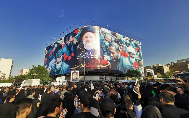 Mourners attend the funeral of Iranian president Ebrahim Raisi, in Tehran, on May 22, 2024. (Atta KENARE / AFP)