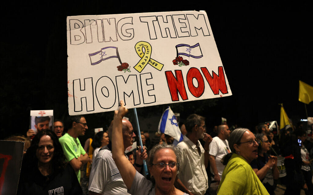 Israelis call for the release of hostages held by terrorists in Gaza since Hamas's October 7 massacre, outside Prime Minister Benjamin Netanyahu's office in Jerusalem on May 22, 2024. (Ahmad Gharabli/AFP)