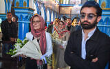 French Ambassador to Tunisia Anne Gueguen (Centre-L) and US Deputy Chief of Mission Natasha Franceschi (C) carry flowers in memory of those killed in a mass shooting last year at the Ghriba synagogue in the resort island of Djerba on May 26, 2024. (Fethi Belaid / AFP)