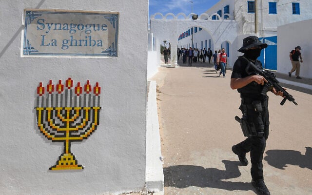 Tunisian security forces stand guard during a visit by the US deputy chief of mission for Tunisia and French ambassador at the Ghriba synagogue in the resort island of Djerba on May 26, 2024. (FETHI BELAID / AFP) Tunisian security forces stand guard during a visit by the US deputy chief of mission for Tunisia and French ambassador at the Ghriba synagogue in the resort island of Djerba on May 26, 2024. (FETHI BELAID / AFP)