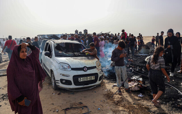 Palestinians look at the destruction after an Israeli strike adjacent to where displaced people were staying in Rafah, Gaza Strip, Monday, May 27, 2024. The Israeli army said the strike had targeted a Hamas compound. (Eyad Baba / AFP) Palestinians look at the destruction after an Israeli strike adjacent to where displaced people were staying in Rafah, Gaza Strip, Monday, May 27, 2024. The Israeli army said the strike had targeted a Hamas compound. (Eyad Baba / AFP)