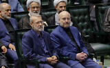 Former Iranian parliament speaker Ali Larijani (L) and reelected speaker Mohammad Bagher Qalibaf (R) attend the inauguration session for the new Parliament in Tehran on May 27, 2024. (AFP)