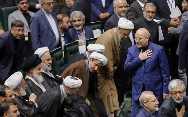 Iran's Parliament Speaker Mohammad Bagher Qalibaf (R) greets lawmakers during the inauguration session for the new Parliament in Tehran on May 27, 2024. (AFP) Iran's Parliament Speaker Mohammad Bagher Qalibaf (R) greets lawmakers during the inauguration session for the new Parliament in Tehran on May 27, 2024. (AFP)