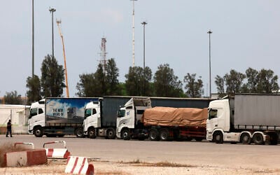 Trucks carrying humanitarian aid are pictured at the Israeli side of the Kerem Shalom border crossing with the Gaza Strip in southern Israel on May 28, 2024, amid the ongoing conflict in the Palestinian territory between Israel and Hamas. (Menahem Kahana/AFP)