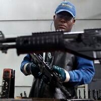 A worker assembles a Galil-GT assault rifle at the Colombian based military weapons manufacturer, Indumil, in Soacha, Colombia. (AP Photo/Fernando Vergara)