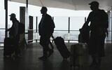 Passengers walk at Heathrow Airport, in London, May 27, 2023. (AP/Kin Cheung)