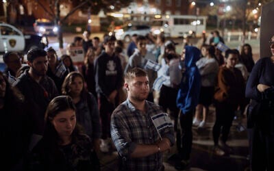 Jewish Rutgers University students and members of the community gather holding placards and flags to hold solidarity and vigil for Israel, October 25, 2023, New Brunswick, New Jersey. (AP Photo/Andres Kudacki)