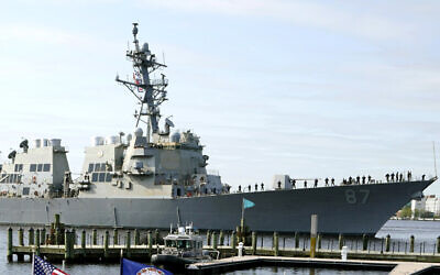 The USS Mason, an Arleigh Burke-class destroyer, passes a dock in Norfolk, Virginia, April 8, 2021. (Steve Helber/AP)