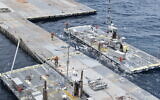 US soldiers assemble the Roll-On, Roll-Off Distribution Facility (RRDF), or floating pier, off the shore of Gaza in the Mediterranean Sea on April 26, 2024. (US Army via AP)