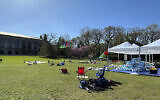 Tents, flags and other supplies remain at Deering Meadow on Northwestern University's campus in Evanston, Ill. on Tuesday, April 30, 2024, a day after the university and protest organizers announced an agreement which largely ended anti-war demonstrations that have lasted days. (AP Photo/Melissa Perez Winder)