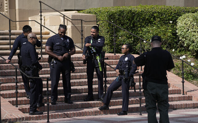Officers stage near the site of a pro-Palestinian, anti-Israel encampment, cleared by police overnight, on the UCLA campus Thursday, May 2, 2024, in Los Angeles. (AP Photo/Mark J. Terrill) Officers stage near the site of a pro-Palestinian, anti-Israel encampment, cleared by police overnight, on the UCLA campus Thursday, May 2, 2024, in Los Angeles. (AP Photo/Mark J. Terrill)