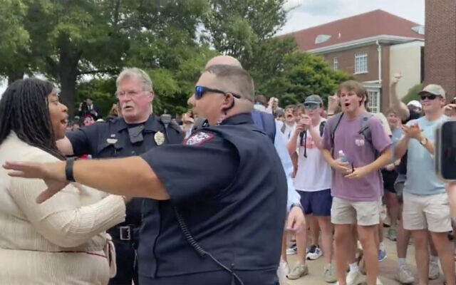 In this photo taken from video provided by Stacey J. Spiehler, a pro-Palestinian protester is confronted by hecklers at the University of Mississippi, May 2, 2024, in Oxford, Mississippi. (Stacey J. Spiehler via AP) In this photo taken from video provided by Stacey J. Spiehler, a pro-Palestinian protester is confronted by hecklers at the University of Mississippi, May 2, 2024, in Oxford, Mississippi. (Stacey J. Spiehler via AP)