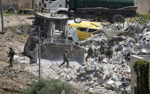 Israeli troops operate in the town of Dayr al-Ghusun, near the West Bank city of Tulkarem, May 4, 2024. (AP Photo/Majdi Mohammed) Israeli troops operate in the town of Dayr al-Ghusun, near the West Bank city of Tulkarem, May 4, 2024. (AP Photo/Majdi Mohammed)
