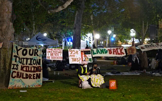 People stand guard outside an encampment set up by pro-Palestinian and anti-Israel demonstrators on the campus at the University of Southern California, May 4, 2024, in Los Angeles. (AP Photo/Ryan Sun) People stand guard outside an encampment set up by pro-Palestinian and anti-Israel demonstrators on the campus at the University of Southern California, May 4, 2024, in Los Angeles. (AP Photo/Ryan Sun)