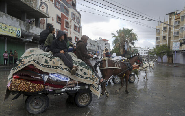 Palestinians leave the eastern side of the southern Gaza city of Rafah following IDF orders to evacuate ahead of a military operation, in Rafah, Gaza Strip, Monday, May 6, 2024. (AP Photo/Ismael Abu Dayyah)