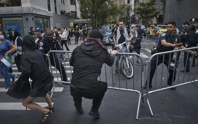 Pro-Palstinian, anti-Israel protesters remove the police barricades near the Metropolitan Museum of Art, where the Met Gala takes place, Monday, May 6, 2024, in New York. (AP Photo/Andres Kudacki)