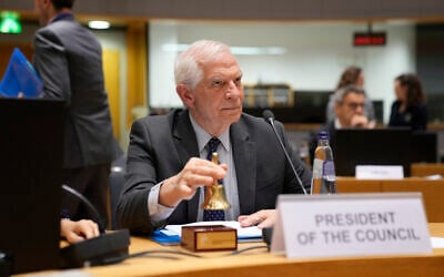 European Union foreign policy chief Josep Borrell rings a bell to signify the start of a meeting at the European Council building in Brussels, May 7, 2024. (AP Photo/ Virginia Mayo)