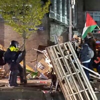 In this image taken from video police arrest activists as they broke up a pro-Palestinian, anti-Israel demonstration camp at the University of Amsterdam in Amsterdam, the Netherlands, May 7, 2024. (AP Photo)