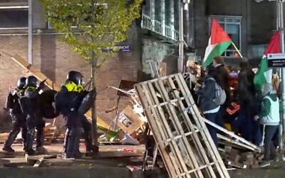 In this image taken from video police arrest activists as they broke up a pro-Palestinian, anti-Israel demonstration camp at the University of Amsterdam in Amsterdam, the Netherlands, May 7, 2024. (AP Photo)