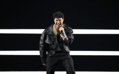 Eric Saade performs the song "Popular" while wearing a Palestinian keffiyeh on his wrist during the opening of the first semifinal at the Eurovision Song Contest in Malmo, Sweden, May 7, 2024. (AP Photo/Martin Meissner)