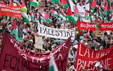 People carry banners and Palestinian flags during an anti-Israel demonstration against Israel's participation in Eurovision ahead of the second semifinal at the Eurovision Song Contest in Malmo, Sweden, Thursday, May 9, 2024. (AP Photo/Martin Meissner)