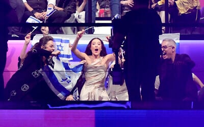 Israel's Eden Golan (center) celebrates advancing to the final during the second semifinal at the Eurovision Song Contest in Malmo, Sweden, May 9, 2024. (AP Photo/Martin Meissner)
