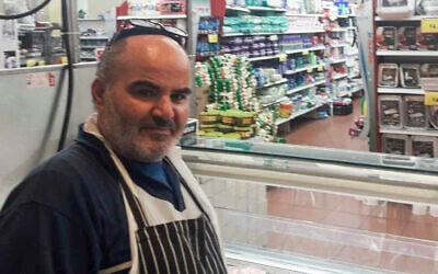 This 2021 photo provided by Haim Parag shows David Ben-Avraham at a supermarket in the Israeli town of Beit Shemesh, where he briefly worked. (Courtesy of Haim Parag via AP)
