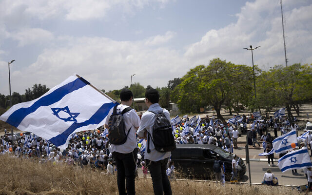 Thousands of Israelis march in the southern city of Sderot calling for Israel to reoccupy the Gaza Strip once the war against Hamas is over, May 14, 2024. (AP Photo/Maya Alleruzzo)
