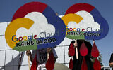 Demonstrators hold signs in protest as they block an entrance to the Google I/O conference in Mountain View, California on May 14, 2024. (AP Photo/Terry Chea)