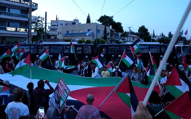 Pro-Palestinian protesters chant slogans outside the Israeli Embassy in Athens, on Wednesday, May 15, 2024. (AP Photo/Thanassis Stavrakis)
