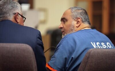 Attorney Ron Bamieh, left, listens to his client, Loay Abdelfattah Alnaji, a professor of computer science at Moorpark College, in Ventura County Superior Court on Nov. 17, 2023, in Ventura, California (AP Photo/Damian Dovarganes, File)