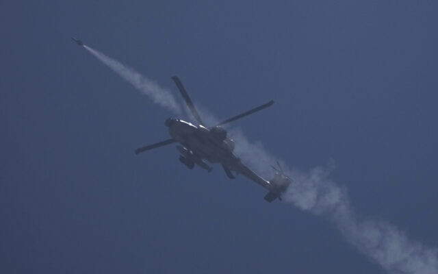 An Israeli Apache helicopter fires a missile towards the Gaza Strip, as seen from southern Israel, May 16, 2024. (AP Photo/Leo Correa)