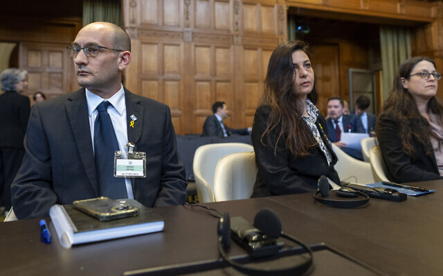 Israeli attorneys Gilad Noam, left, Tamar Kaplan Tourgeman, center, and Avigail Frisch Ben Avraham, right, wait for the start of hearings at the International Court of Justice, in The Hague, Netherlands, May 16, 2024. (AP Photo/Peter Dejong)