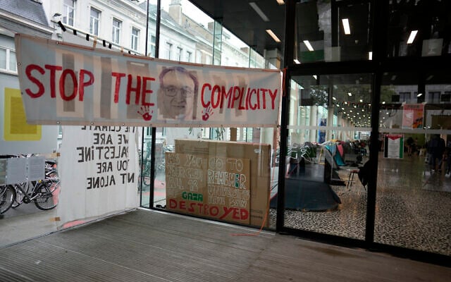 Posters and banners line the entrance to an encampment, set up by pro-Palestinian students and activists at Ghent University, in Ghent, Belgium, May 16, 2024. (AP Photo/Virginia Mayo)
