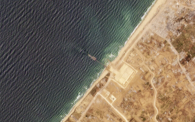 This satellite image from Planet Labs PBC shows a pier installed by the US military in the Gaza Strip on Thursday, May 16, 2024. (Planet Labs PBC via AP) This satellite image from Planet Labs PBC shows a pier installed by the US military in the Gaza Strip on Thursday, May 16, 2024. (Planet Labs PBC via AP)