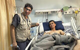 Dr. Ammar Ghanem, an ICU specialist from Detroit volunteering in one of Gaza's last functioning hospitals, stands by a young patient recovering from pneumonia on May 9, 2024, in Khan Younis, Gaza. (Photo via AP)