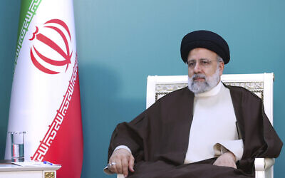 President Ebrahim Raisi attends a meeting during the inauguration ceremony of dam of Qiz Qalasi, or Castel of Girl in Azeri, at the border of Iran and Azerbaijan, May 19, 2024. (Iranian Presidency Office via AP)
