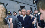 Ivan F. Boesky, center, leaves federal court in New York, April 24, 1987, after pleading guilty to one count of violating federal securities laws. (AP Photo/ G. Paul Burnett, File)
