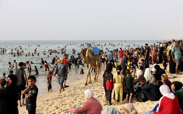 Palestinians enjoy a day along the Mediterranean Sea during a heat wave at Khan Younis beach, southern Gaza Strip, Monday, May 20, 2024. (AP/Saher Alghorra) Palestinians enjoy a day along the Mediterranean Sea during a heat wave at Khan Younis beach, southern Gaza Strip, Monday, May 20, 2024. (AP/Saher Alghorra)