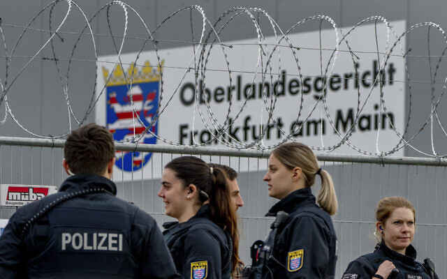 German police officers stand under barbed wire securing a temporary courtroom that was built for a trial starting on Tuesday in Frankfurt, Germany, Tuesday, May 21, 2024. The alleged leaders of a suspected far-right plot to topple the German government are among nine suspects going on trial in Frankfurt Tuesday (AP Photo/Michael Probst) German police officers stand under barbed wire securing a temporary courtroom that was built for a trial starting on Tuesday in Frankfurt, Germany, Tuesday, May 21, 2024. The alleged leaders of a suspected far-right plot to topple the German government are among nine suspects going on trial in Frankfurt Tuesday (AP Photo/Michael Probst)