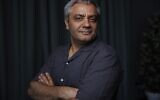 Director Mohammad Rasoulof poses for a portrait photograph for the film 'The Seed of the Sacred Fig' at the 77th international film festival, Cannes, southern France, Thursday, May 23 2024. (Vianney Le Caer/Invision/AP)