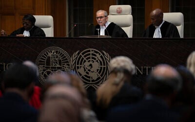 Presiding Judge Nawaf Salam reads the ruling of the International Court of Justice, or World Court, in The Hague, Netherlands, May 24, 2024 (AP Photo/Peter Dejong)