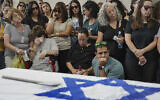 Mourners attend the funeral of Michel Nisenbaum, who was killed during Hamas's October 7 attack and whose body was taken into Gaza, in Ashkelon, Israel, on May 26, 2024. (Tsafrir Abayov/AP)