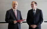 PA Prime Minister Mohammad Mustafa, left, speaks after receiving a document handed over by Norway's Foreign Minister Espen Barth Eide, right, prior to a meeting for talks on the Middle East in Brussels, May 26, 2024. (AP Photo/Virginia Mayo)