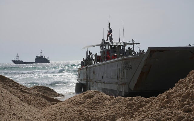 A US Army landing craft is seen beached in Ashdod on Sunday, May 26, 2024, after being swept by wind and current from the temporary humanitarian pier in the Gaza Strip. (AP Photo/Tsafrir Abayov) A US Army landing craft is seen beached in Ashdod on Sunday, May 26, 2024, after being swept by wind and current from the temporary humanitarian pier in the Gaza Strip. (AP Photo/Tsafrir Abayov)