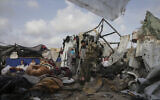 Displaced Palestinians inspect their tents next to an UNRWA facility west of Rafah city, Gaza Strip, May 28, 2024. (AP Photo/Jehad Alshrafi)