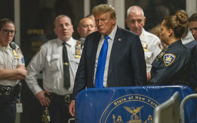 Former US president Donald Trump walks outside of a Manhattan courtroom after a jury convicted him of felony crimes for falsifying business records in a scheme to illegally influence the 2016 election, May 30, 2024, in New York. (Steven Hirsch/New York Post via AP, Pool) Former US president Donald Trump walks outside of a Manhattan courtroom after a jury convicted him of felony crimes for falsifying business records in a scheme to illegally influence the 2016 election, May 30, 2024, in New York. (Steven Hirsch/New York Post via AP, Pool)