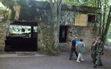 Tourists visit the ruins of Adolf Hitler's headquarters the 'Wolf's Lair' in Gierloz, northeastern Poland, July 17 2004. (AP Photo/ Czarek Sokolowski, File)